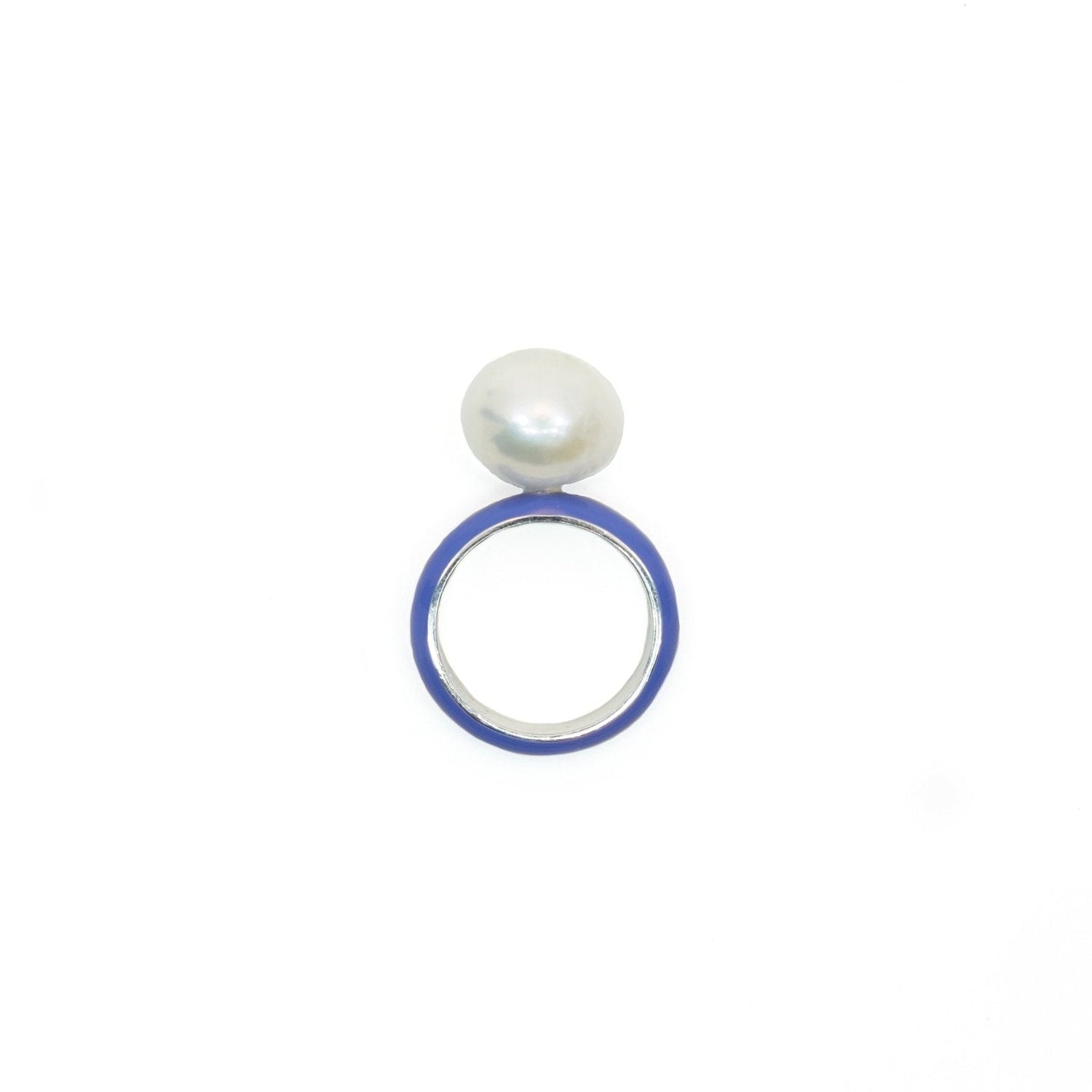 A sterling silver ring with a blue enamel band and a white baroque pearl centerpiece.