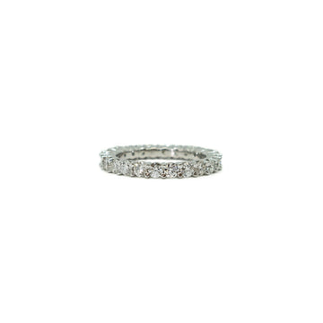 A band-style 18K gold diamond stacking ring with multiple small natural diamonds set in a row.