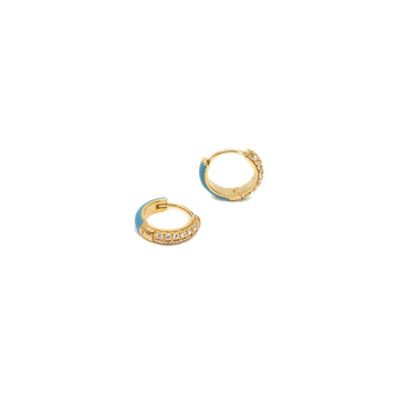 A pair of 18K gold huggie earrings with diamond pave and enamel accents.