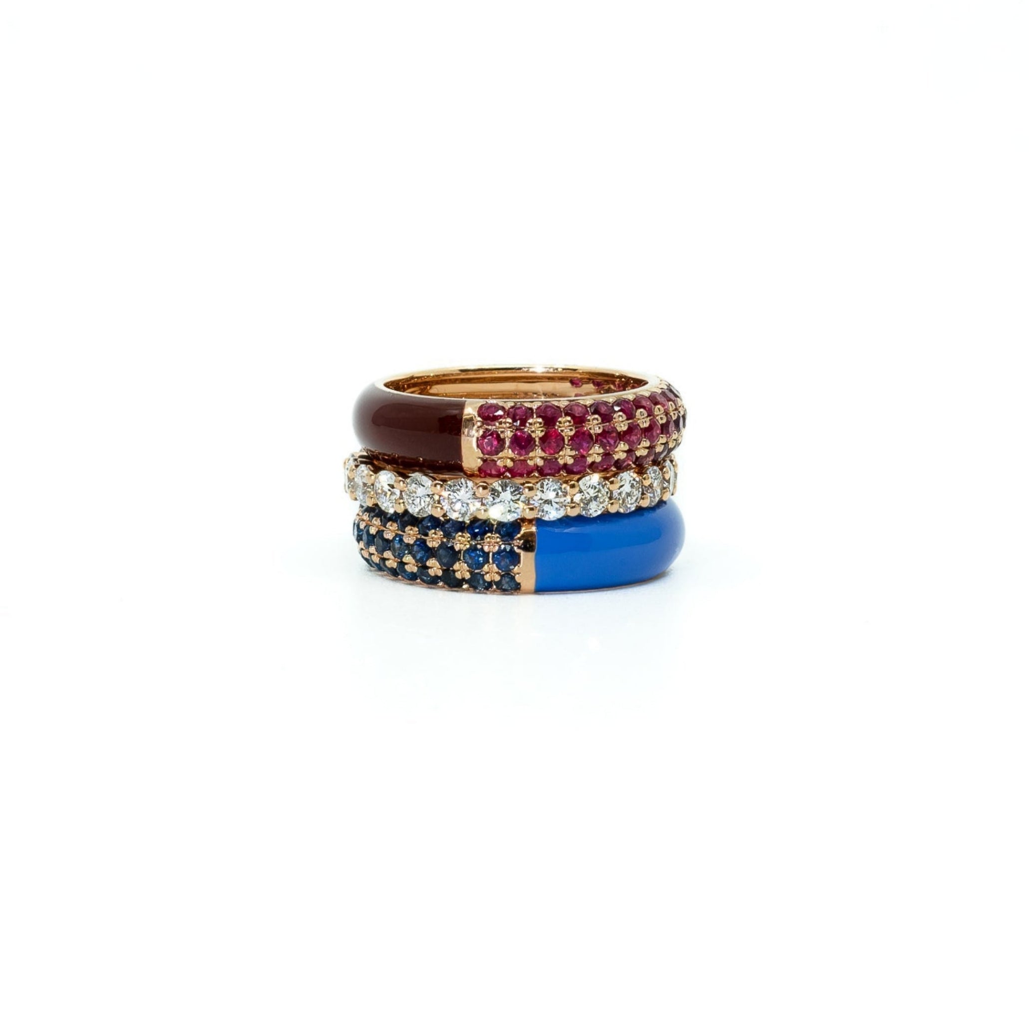 A set of stacking rings in 18K gold, featuring a wide split pave gemstone design with enamel inlays, displayed against a white background.