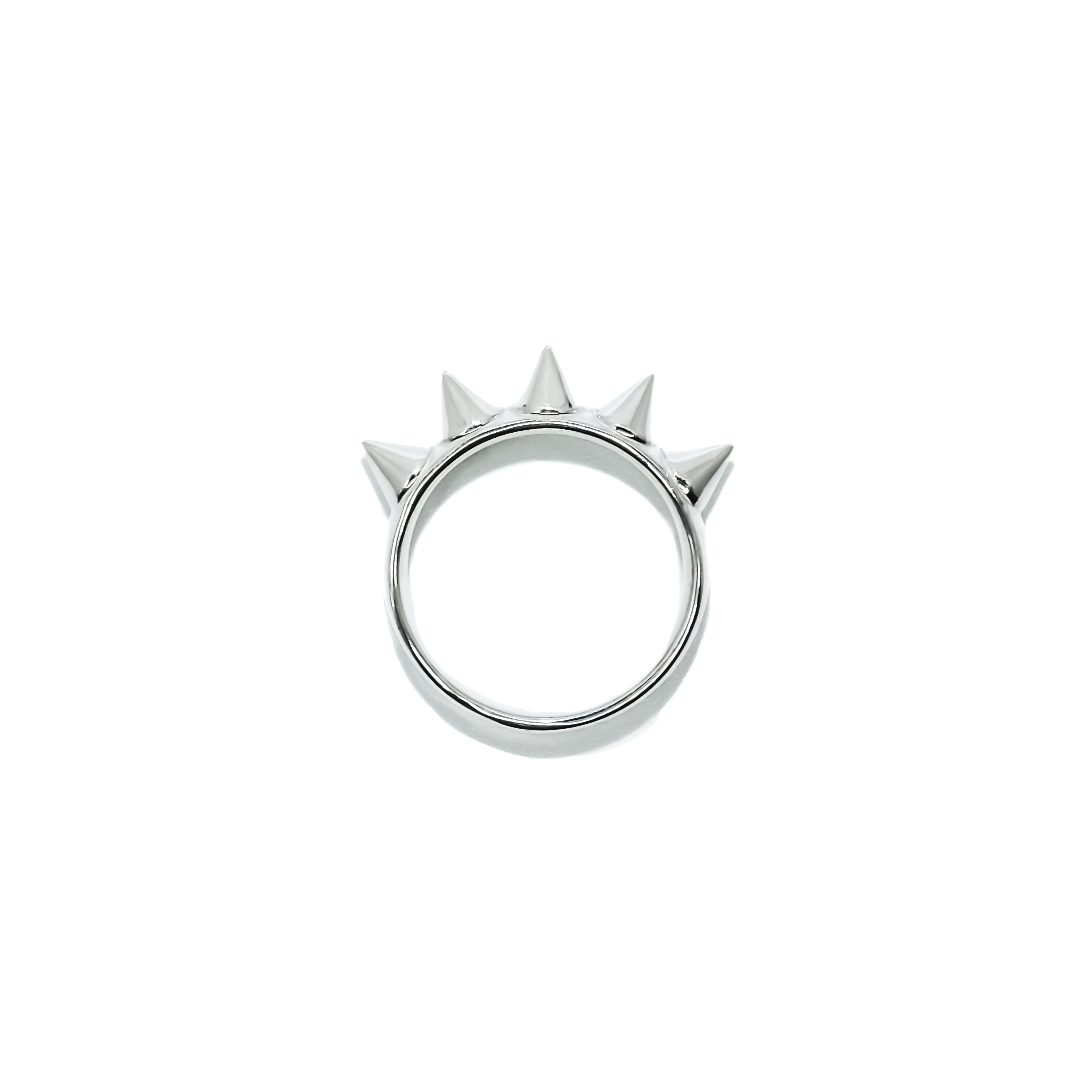 Silver ring with spike design on a white background