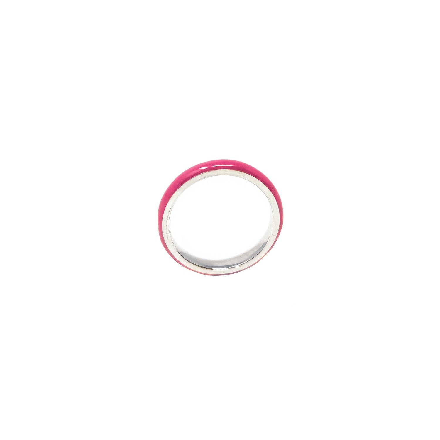 A thin enamel stacking ring in fuchsia color on a white background, with a silver band.