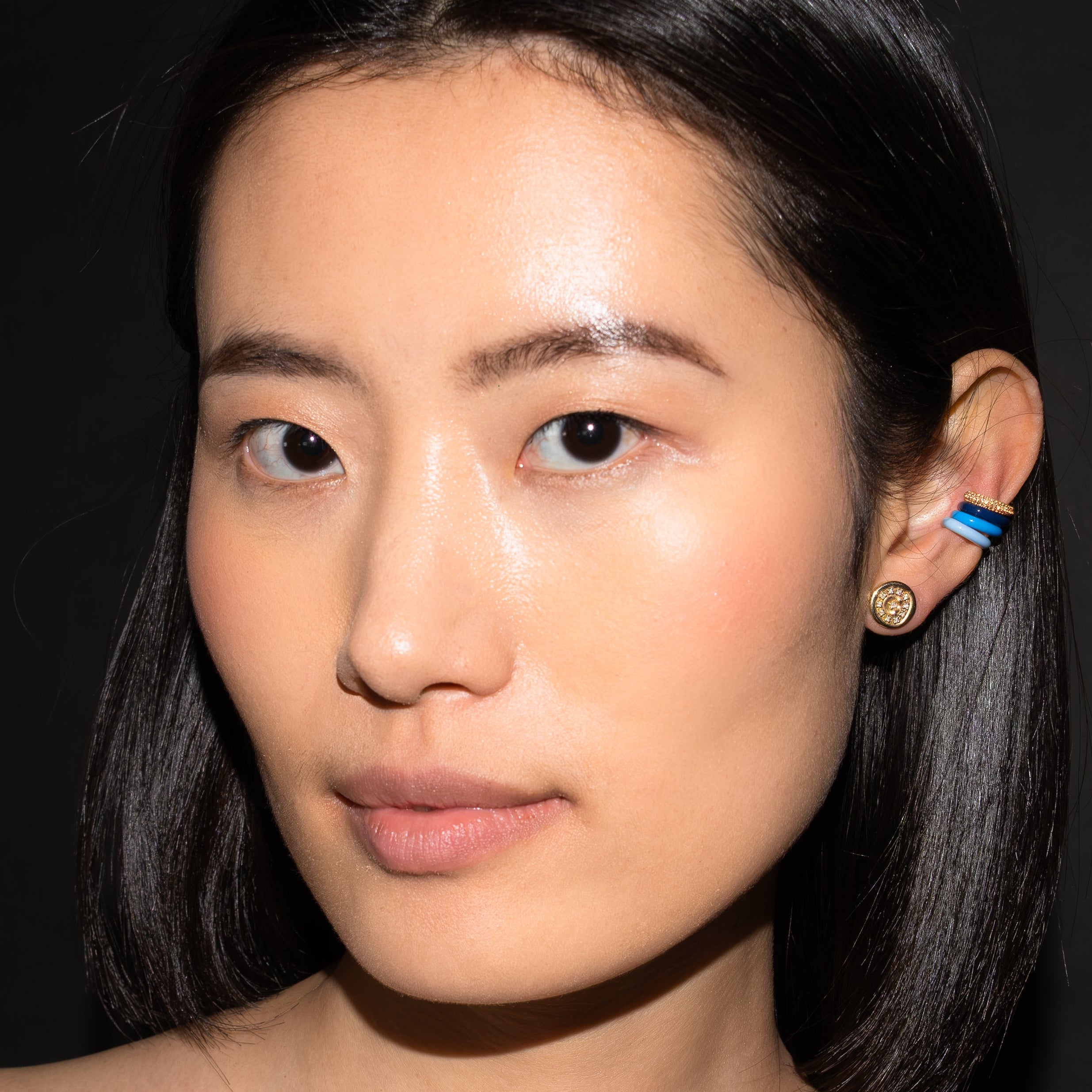 Model wearing FRY POWERS Sparkle Ear Cuff in an ear stack